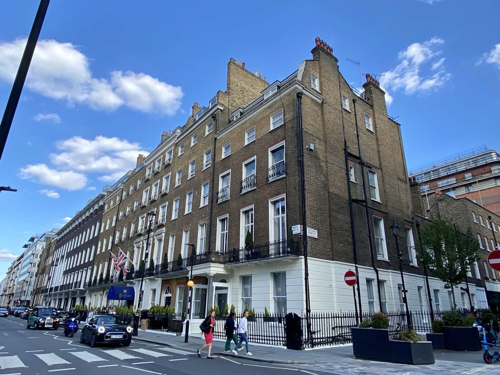Georgian brick terraces with black railings on the corner of Seymour Street and Old Quebec Street in Marylebone