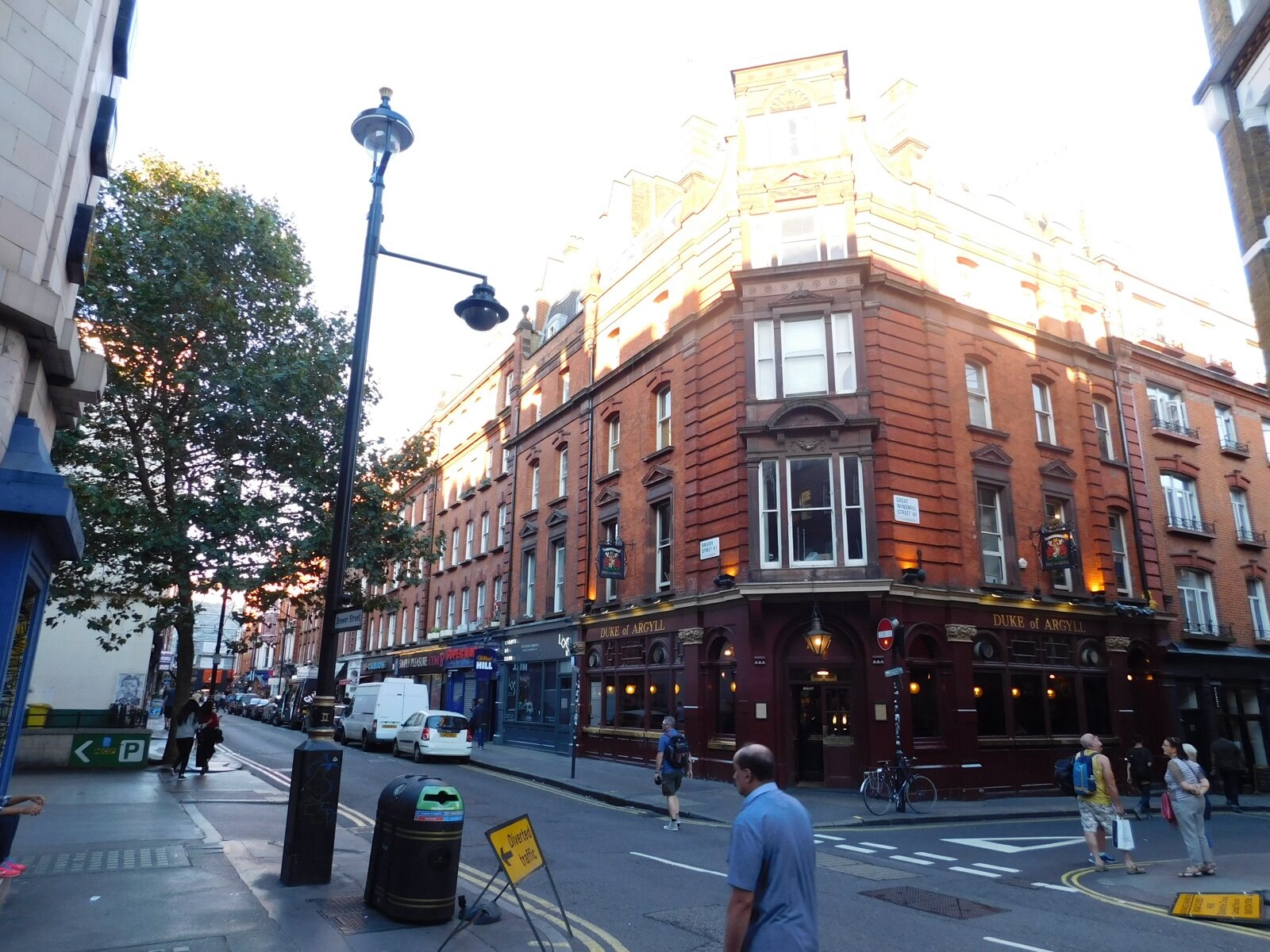 Brewer Street in Soho at its corner with Great Windmill Street, with the Duke of Argyll pub and a row of red-brick buildings
