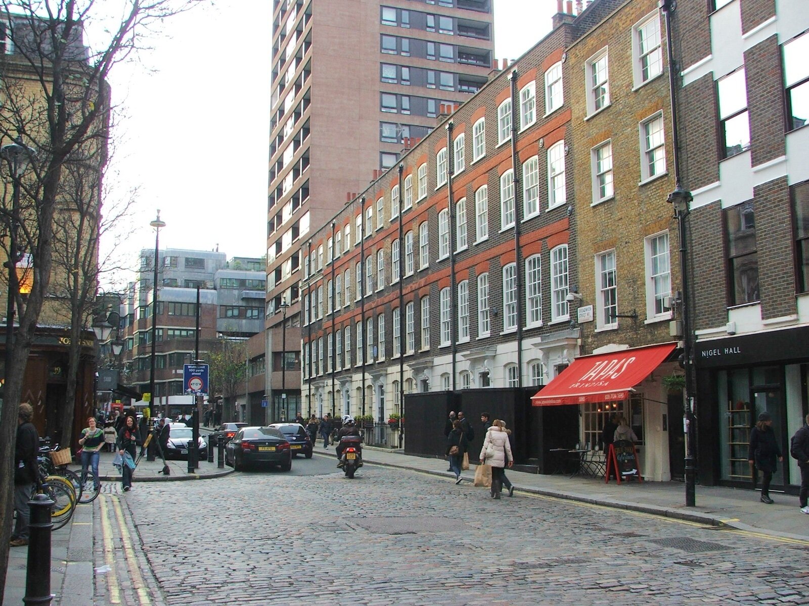 Broadwick Street in Soho, with the John Snow pub on the left and a cobbled street surface