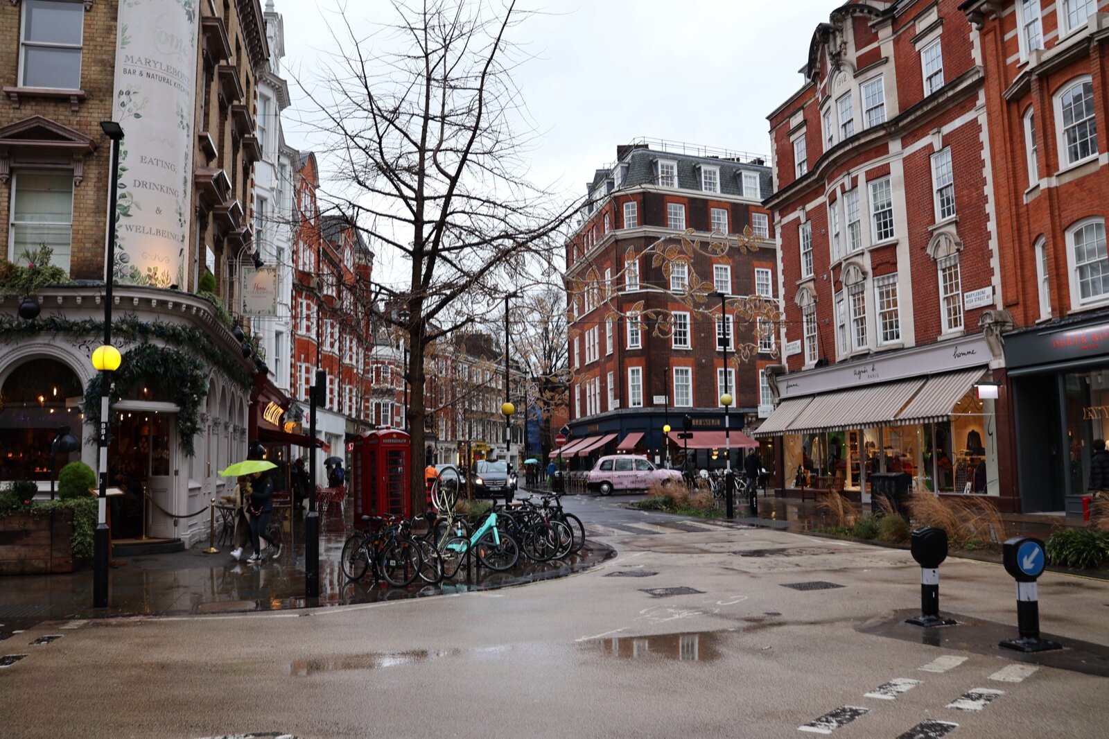 Marylebone High Street, London, with red-brick mansion blocks, shops and a red telephone box
