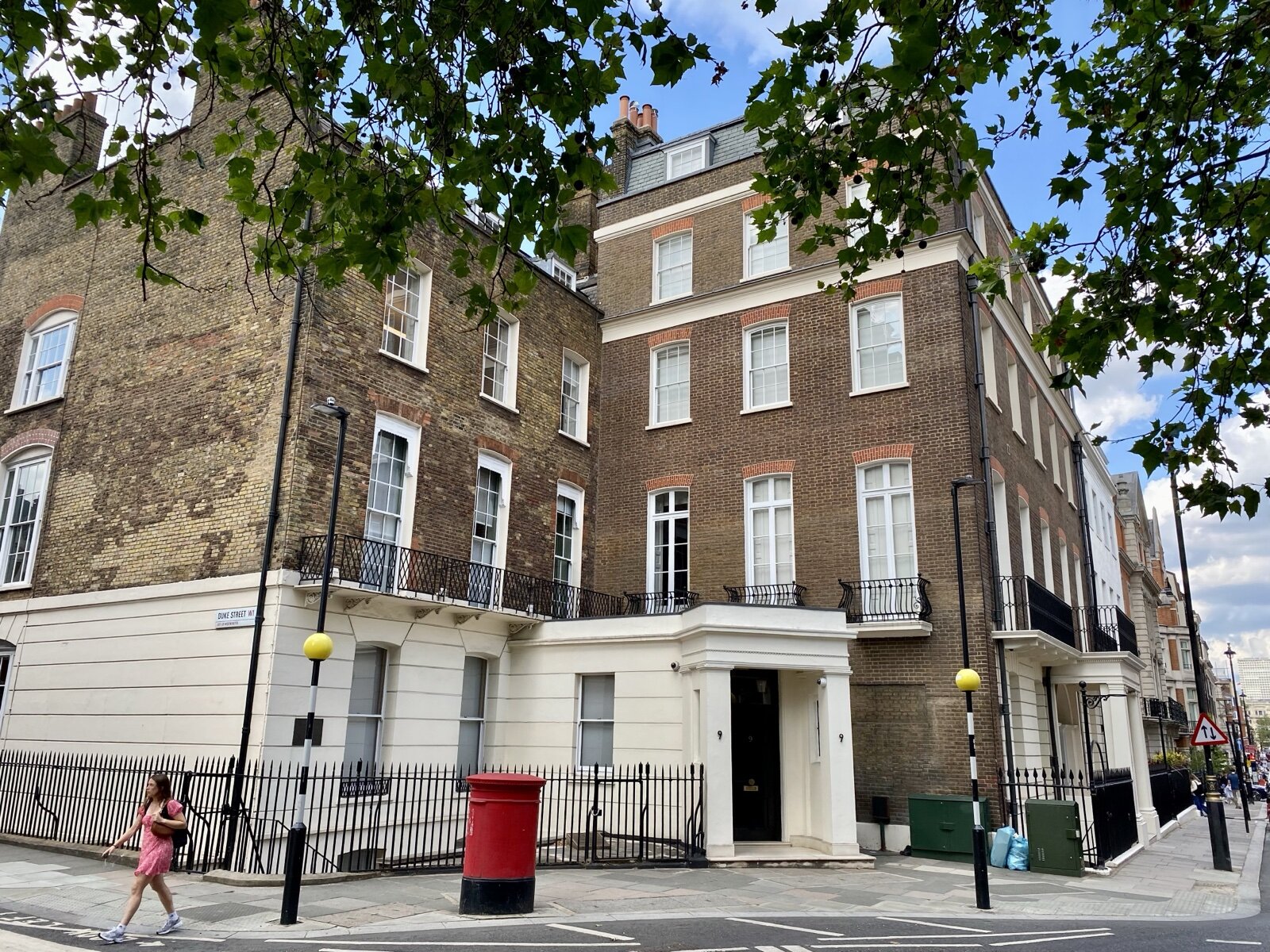 Georgian brick townhouse at the corner of Grosvenor Square and Duke Street, Mayfair