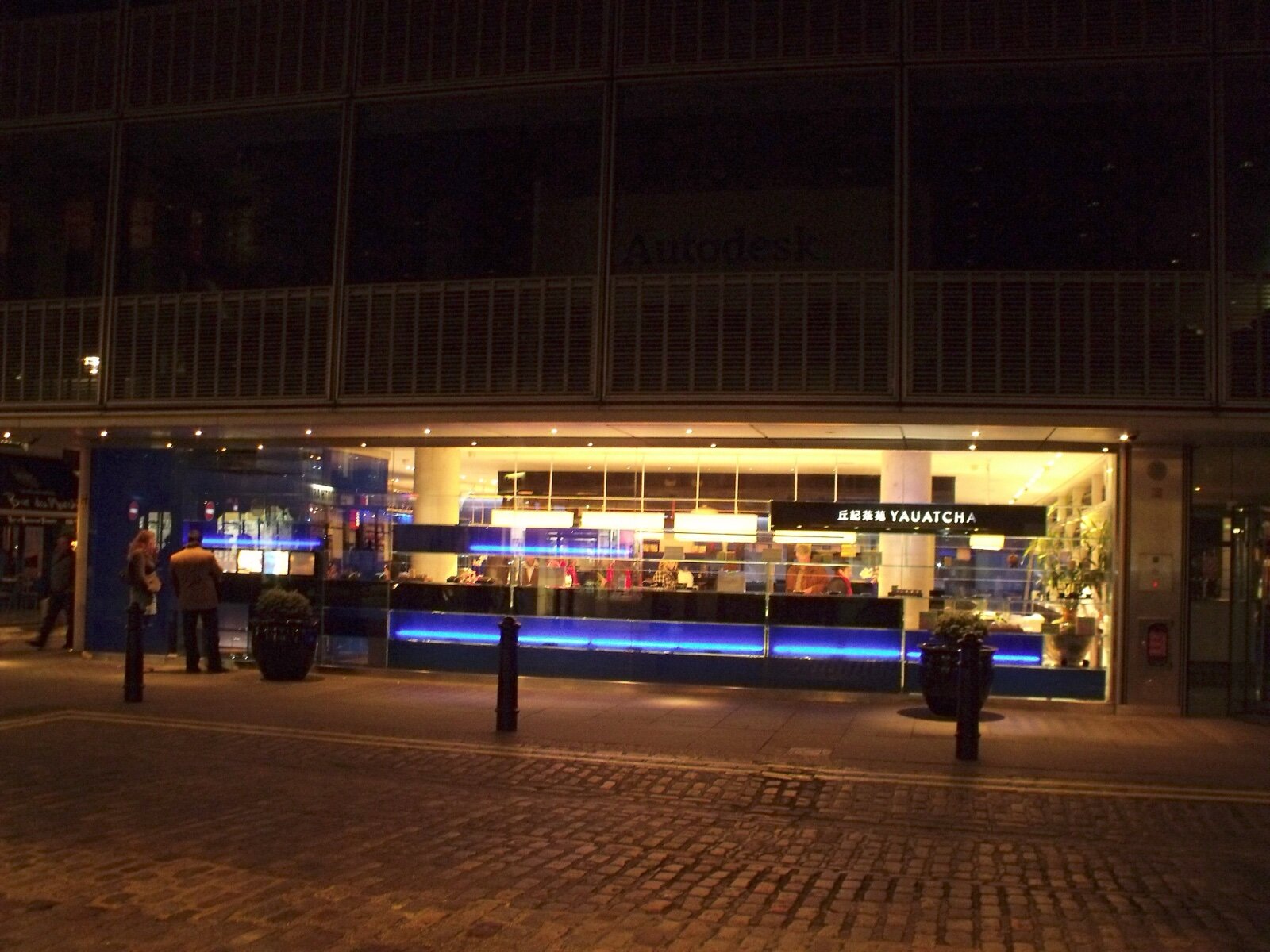 The glass frontage of Yauatcha on Broadwick Street, Soho, lit up at night