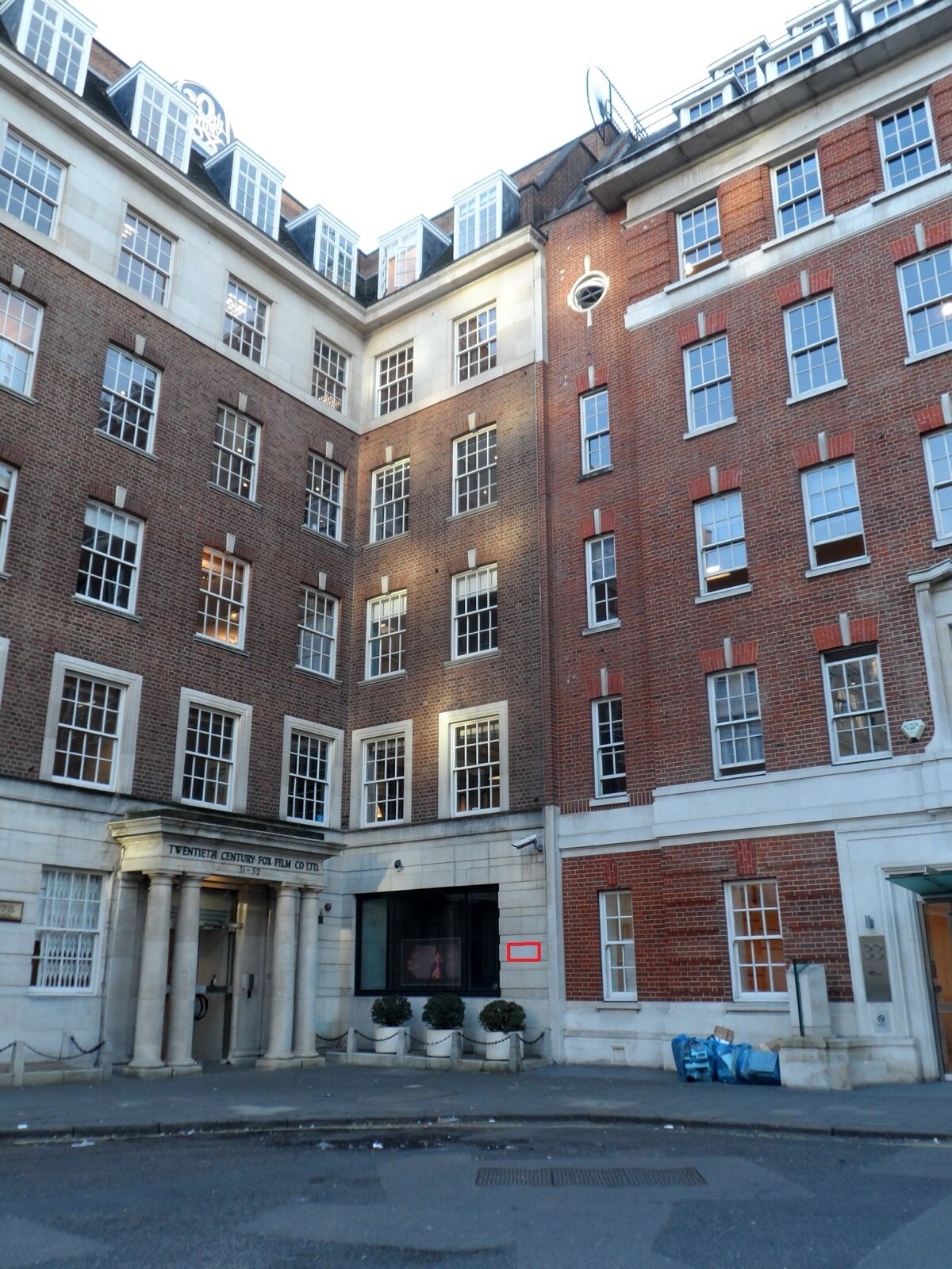 Twentieth Century House at 31-32 Soho Square, a brick and stone office building with a columned entrance marked Twentieth Century Fox Film Co Ltd
